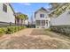 The property has a large backyard with a nice lawn and mature landscaping for privacy and beauty at 213 Amberjack Ln, Charleston, SC 29492