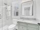 Modern bathroom featuring a glass shower, neutral countertop vanity and natural light at 213 Amberjack Ln, Charleston, SC 29492