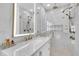Modern bathroom features a glass-enclosed shower, marble countertop vanity and gold fixtures at 213 Amberjack Ln, Charleston, SC 29492