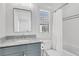 Cozy bathroom featuring marble countertop vanity, shower-tub combination and ample natural light at 213 Amberjack Ln, Charleston, SC 29492