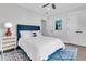 Comfortable bedroom with a blue headboard bed, white bedding and neutral-toned walls at 213 Amberjack Ln, Charleston, SC 29492