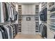 Organized walk-in closet with custom shelving and ample storage for clothes and shoes at 213 Amberjack Ln, Charleston, SC 29492