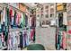 Spacious walk-in closet with custom shelving, clothing racks, and storage for handbags at 213 Amberjack Ln, Charleston, SC 29492