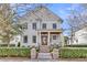 Charming two-story home featuring a welcoming front porch and manicured landscaping at 213 Amberjack Ln, Charleston, SC 29492
