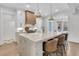 Bright kitchen featuring an island with seating, marble countertops, and stainless steel appliances at 213 Amberjack Ln, Charleston, SC 29492