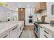 Modern kitchen featuring stainless steel appliances, marble countertops, and custom wood accents at 213 Amberjack Ln, Charleston, SC 29492