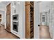 Kitchen with built-in wine storage and stainless steel appliances next to the kitchen pantry at 213 Amberjack Ln, Charleston, SC 29492