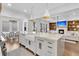 Gourmet kitchen featuring a large center island, farmhouse sink, and stainless steel appliances at 213 Amberjack Ln, Charleston, SC 29492