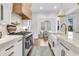 Well-appointed kitchen with stainless steel range, custom cabinetry, and view to dining area at 213 Amberjack Ln, Charleston, SC 29492