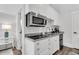 Modern kitchenette featuring stainless steel appliances and white cabinetry at 213 Amberjack Ln, Charleston, SC 29492