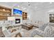 Bright living room with coffered ceilings, fireplace, built-ins, and contemporary furnishings at 213 Amberjack Ln, Charleston, SC 29492