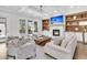 Cozy living room showcasing built-in shelving, fireplace and comfortable seating at 213 Amberjack Ln, Charleston, SC 29492