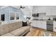 Cozy living space with a comfortable sofa, a kitchenette, and plenty of natural light at 213 Amberjack Ln, Charleston, SC 29492