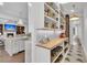 Walk-in pantry with ample storage and shelving adjacent to a marble kitchen island at 213 Amberjack Ln, Charleston, SC 29492