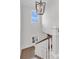 Bright staircase with white railings, hardwood floors, custom light fixture, and natural light at 213 Amberjack Ln, Charleston, SC 29492