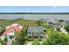 Stunning waterfront home with a green roof, lush landscaping, and neighborhood docks at 2156 Cheswick Ln, Mount Pleasant, SC 29466