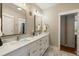 Bathroom featuring double sinks with marble countertop and white cabinets at 2156 Cheswick Ln, Mount Pleasant, SC 29466