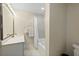 Well-lit bathroom with a modern vanity, bathtub with shower, and contemporary fixtures at 2156 Cheswick Ln, Mount Pleasant, SC 29466