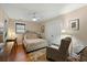 Cozy bedroom featuring a comfortable bed, ample closet space, and a well-lit desk area at 2156 Cheswick Ln, Mount Pleasant, SC 29466