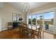 Dining room featuring a chandelier and sliding doors to the deck with marsh views at 2156 Cheswick Ln, Mount Pleasant, SC 29466