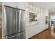 Spacious kitchen featuring stainless steel refrigerator, white cabinets, and marble countertops at 2156 Cheswick Ln, Mount Pleasant, SC 29466