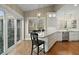 Bright kitchen featuring white cabinets, stainless appliances, marble counters, and island seating at 2156 Cheswick Ln, Mount Pleasant, SC 29466
