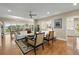 Bright living room featuring hardwood floors, comfortable seating, and a ceiling fan at 2156 Cheswick Ln, Mount Pleasant, SC 29466