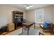 Home office featuring a large desk, comfortable seating, and a bookcase filled with books and decorations at 2156 Cheswick Ln, Mount Pleasant, SC 29466