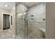 Walk-in shower with a glass door and a shower head, along with stone accents at 2156 Cheswick Ln, Mount Pleasant, SC 29466
