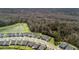 Aerial view of neighborhood with the house, pond and trees in the neighborhood at 222 River Martin Ct, Summerville, SC 29483