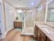 Bathroom featuring double sink vanity, granite countertop, tile flooring and a glass enclosed shower at 222 River Martin Ct, Summerville, SC 29483