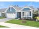 Charming home featuring a well-maintained lawn, a two car garage and a cozy covered front porch at 222 River Martin Ct, Summerville, SC 29483