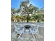 Outdoor fire pit surrounded by Adirondack chairs; perfect for cozy evenings and community gatherings at 222 River Martin Ct, Summerville, SC 29483