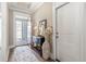 Elegant foyer showcasing a stylish table, mirror, and a glimpse of the outdoors through the front door at 222 River Martin Ct, Summerville, SC 29483