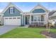 Beautiful single-Gathering home with a well-maintained lawn and a charming front porch at 222 River Martin Ct, Summerville, SC 29483