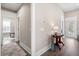 Hallway featuring dark wood flooring, a side table with lamp, and doorway openings to other rooms at 222 River Martin Ct, Summerville, SC 29483