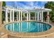 The hot tub features an overhead trellis to provide partial shade, and sits on a brick surround at 222 River Martin Ct, Summerville, SC 29483