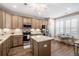 A well-equipped kitchen with an island, stainless steel appliances, and a cozy breakfast nook at 222 River Martin Ct, Summerville, SC 29483
