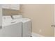 Bright laundry room with white washer and dryer at 222 River Martin Ct, Summerville, SC 29483