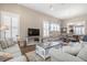 Inviting living room featuring comfortable seating, a large TV, and an open layout to the dining area at 222 River Martin Ct, Summerville, SC 29483