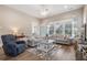 Spacious living area with cozy seating arrangements and ample natural light for a relaxing atmosphere at 222 River Martin Ct, Summerville, SC 29483