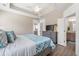 Cozy bedroom with a tray ceiling, a view of the ensuite bathroom, and a calm, inviting atmosphere at 222 River Martin Ct, Summerville, SC 29483