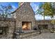 An outdoor fireplace with brick surround offers a cozy gathering spot on the patio at 222 River Martin Ct, Summerville, SC 29483