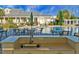 Next to the pool area sits a sink for outdoor washing or bartending, with chairs and tables in the background at 222 River Martin Ct, Summerville, SC 29483