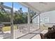 Relaxing screened porch with outdoor seating area and view of the backyard at 222 River Martin Ct, Summerville, SC 29483