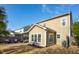 Backyard showcasing a well-maintained lawn, landscaped garden, and patio with stylish outdoor seating at 225 Nelliefield Creek Dr, Wando, SC 29492