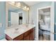 Bright bathroom with double sink vanity and view of main bedroom at 225 Nelliefield Creek Dr, Wando, SC 29492