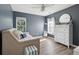 Cozy bedroom with daybed, neutral decor, and ample natural light at 225 Nelliefield Creek Dr, Wando, SC 29492
