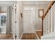 Inviting foyer with wood floors and staircase, showcasing a bright and welcoming entrance to the home at 225 Nelliefield Creek Dr, Wando, SC 29492