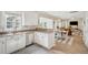 Bright kitchen with stainless appliances and a seamless flow into the living and dining areas at 225 Nelliefield Creek Dr, Wando, SC 29492